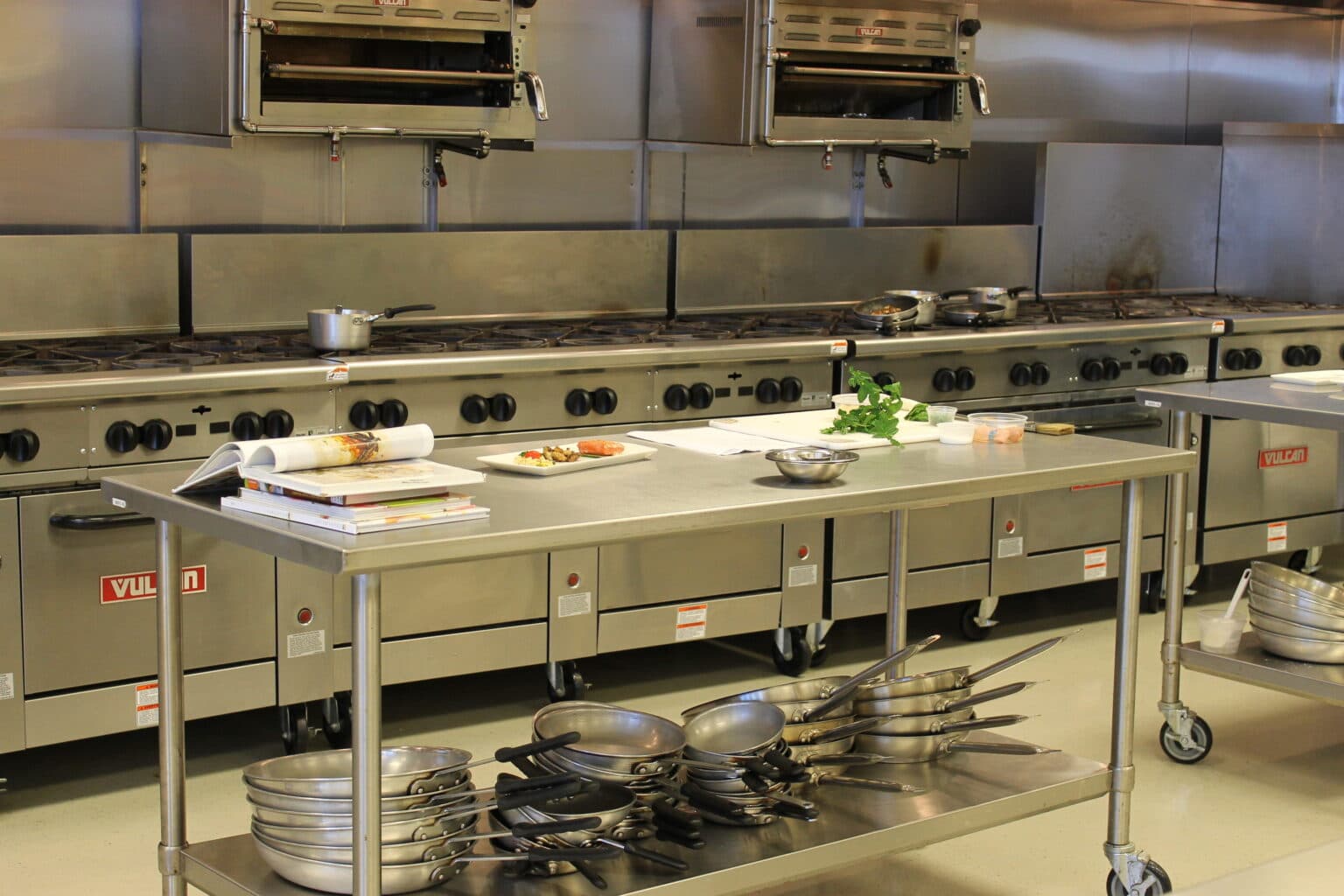Modern commercial kitchen with stainless steel equipment